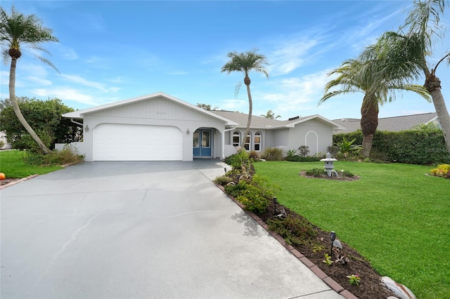 single story home with a front lawn and a garage