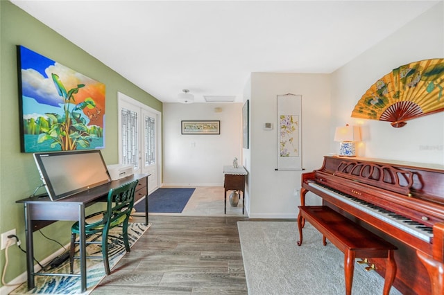 misc room with hardwood / wood-style floors and french doors