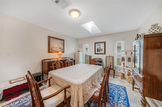 dining space with a skylight