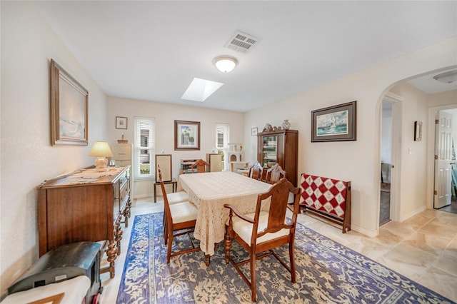 dining space featuring a skylight