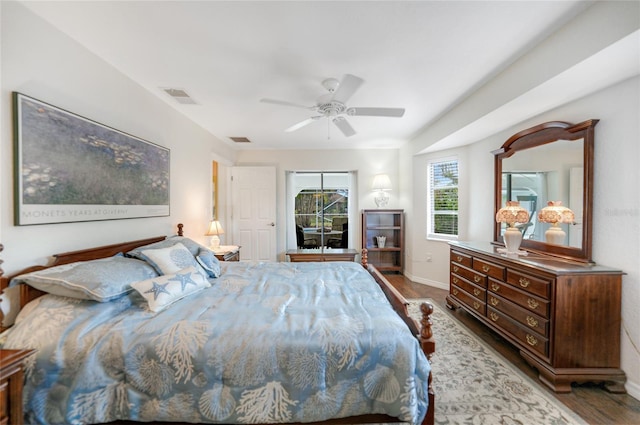 bedroom featuring dark hardwood / wood-style flooring and ceiling fan