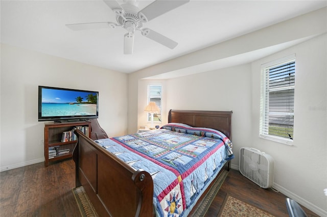 bedroom featuring ceiling fan and dark hardwood / wood-style floors