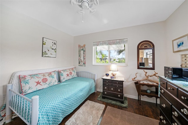 bedroom featuring ceiling fan and dark hardwood / wood-style flooring