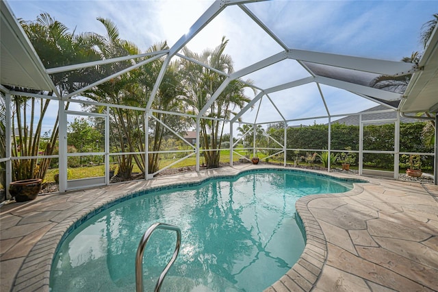 view of pool featuring a lanai and a patio area