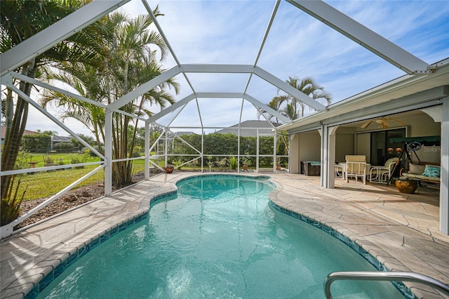 view of pool featuring a patio and a lanai