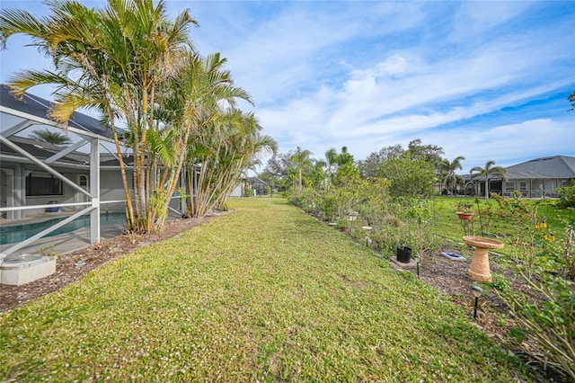 view of yard with a lanai