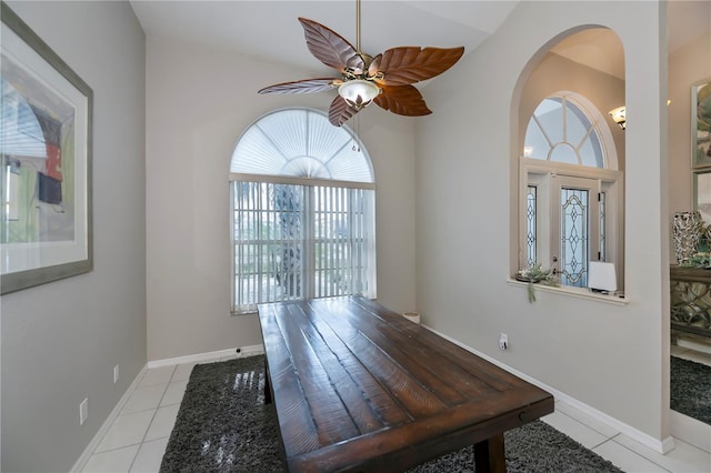 dining area featuring ceiling fan and light tile patterned floors