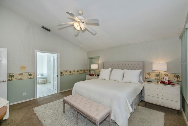 bedroom with connected bathroom, ceiling fan, and carpet floors