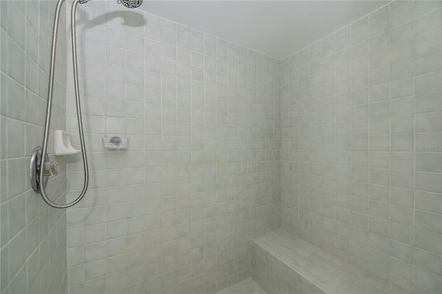 bathroom with tiled shower