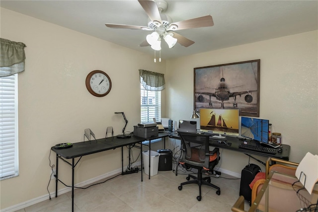 tiled office space featuring ceiling fan