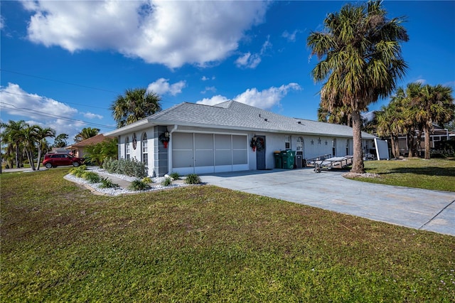 ranch-style home with a garage and a front yard