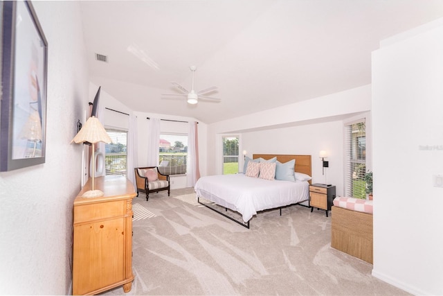 bedroom featuring light carpet, ceiling fan, and lofted ceiling