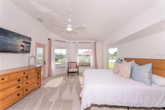 carpeted bedroom with ceiling fan and lofted ceiling