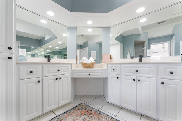 bathroom with tile patterned flooring, vanity, and an enclosed shower