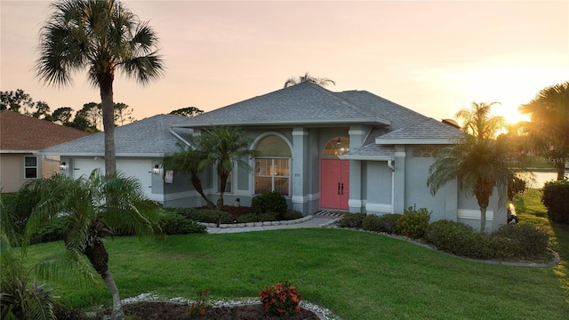 view of front of home with a lawn