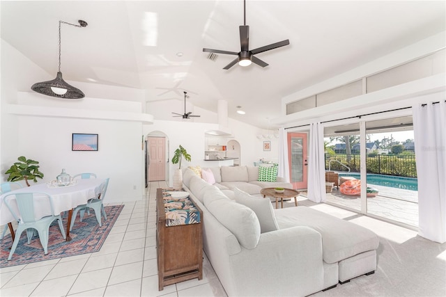 living room featuring light tile patterned floors, vaulted ceiling, and ceiling fan