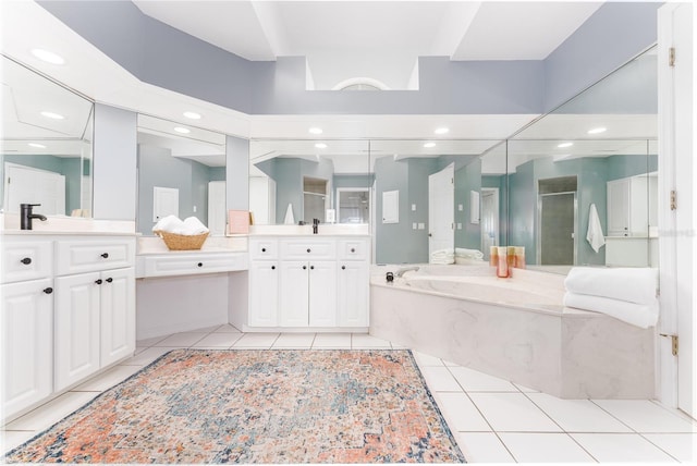 bathroom with tile patterned flooring, a washtub, a high ceiling, and vanity