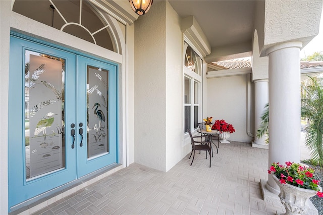 property entrance featuring french doors