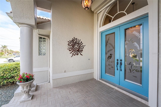 property entrance featuring french doors