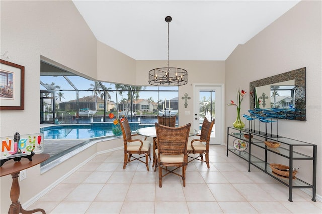 dining room featuring plenty of natural light, light tile patterned flooring, and a chandelier