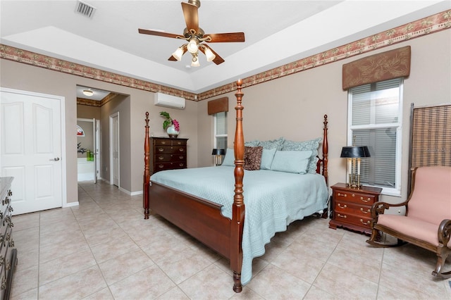 tiled bedroom featuring ceiling fan and a wall unit AC