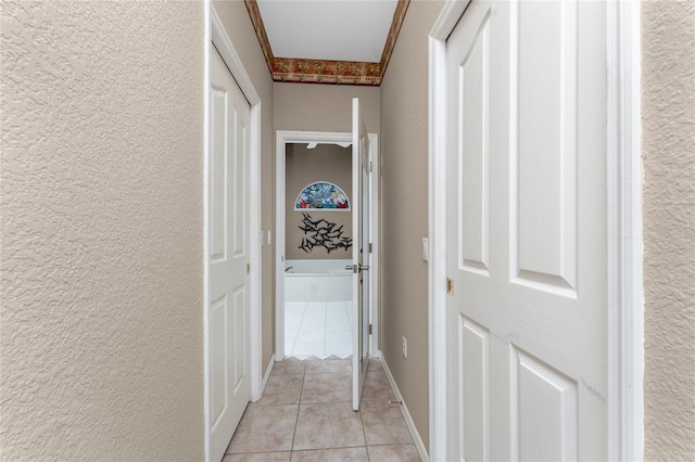 hall with light tile patterned floors