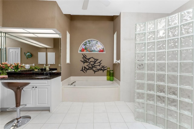 bathroom featuring ceiling fan, sink, and shower with separate bathtub