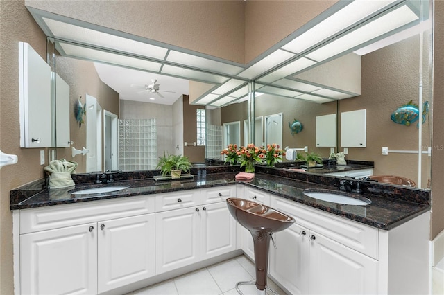 bathroom featuring tile patterned floors, ceiling fan, and vanity