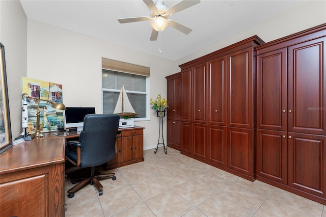 home office with ceiling fan and light tile patterned floors