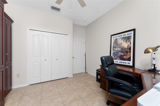 tiled office space with ceiling fan