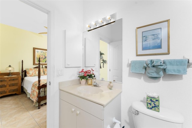 bathroom featuring tile patterned floors, vanity, and toilet