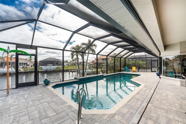 view of pool with a boat dock, a water view, a patio area, and a lanai