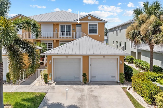 view of front of house featuring a balcony and a garage