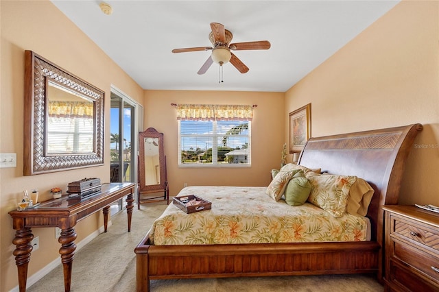 bedroom featuring light carpet and ceiling fan