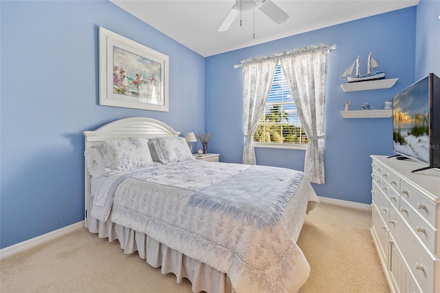 bedroom featuring light colored carpet and ceiling fan