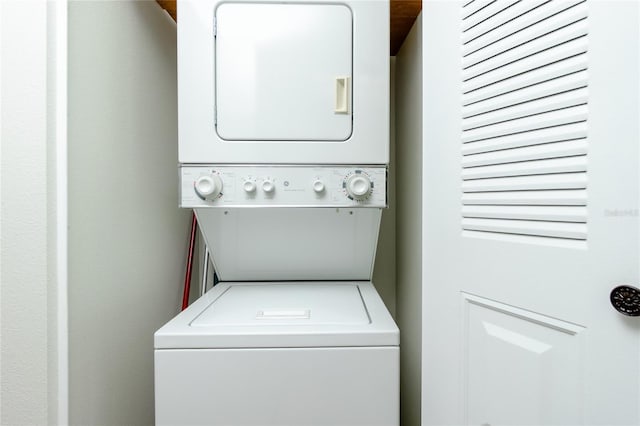 washroom with stacked washer / drying machine