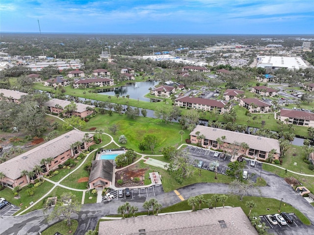 birds eye view of property featuring a water view