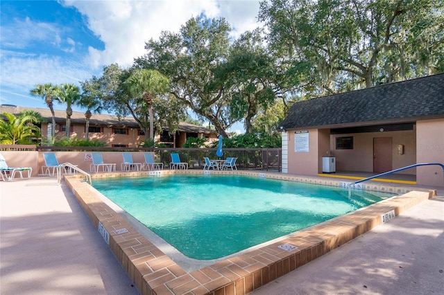 view of swimming pool featuring a patio