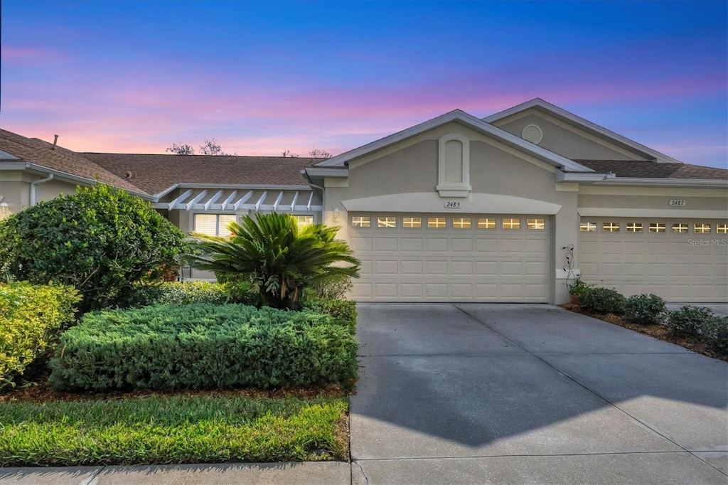 view of front of property with a garage