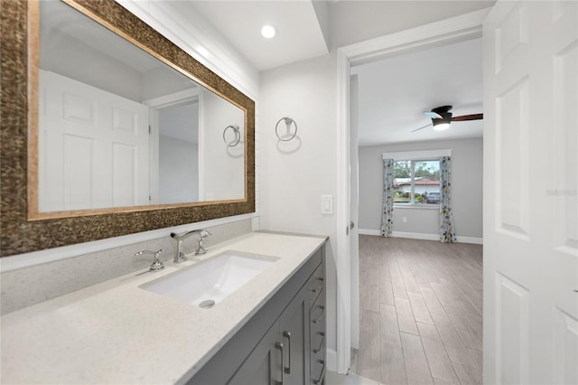 bathroom featuring vanity and ceiling fan