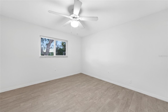 spare room with ceiling fan and light hardwood / wood-style flooring