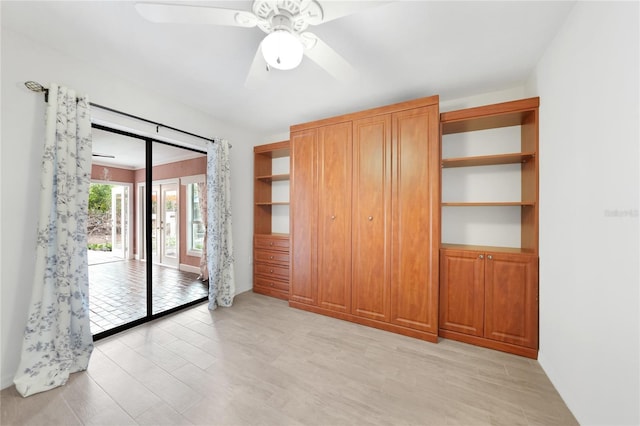 unfurnished room featuring ceiling fan and light wood-type flooring