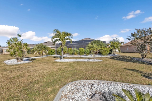 view of yard featuring a lanai