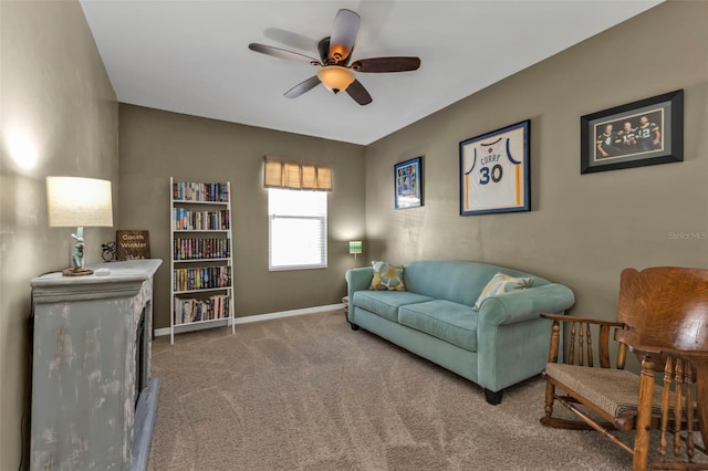 living room with ceiling fan and carpet