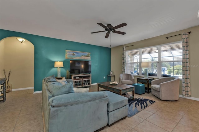 tiled living room with ceiling fan