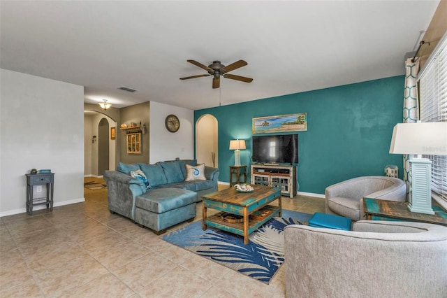 living room featuring ceiling fan and tile patterned flooring