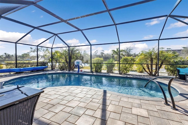 view of pool with a lanai and a patio area