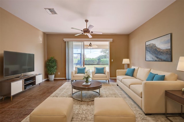 tiled living room with ceiling fan