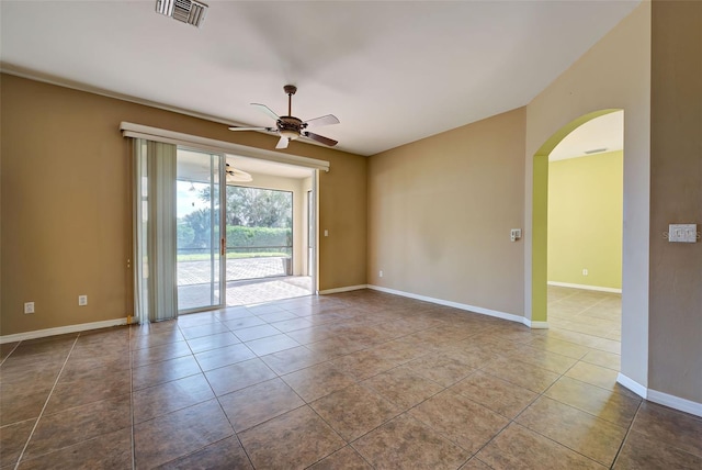 unfurnished room featuring tile patterned flooring and ceiling fan