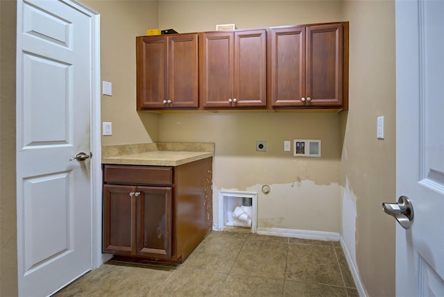 clothes washing area featuring hookup for an electric dryer, gas dryer hookup, cabinets, and hookup for a washing machine